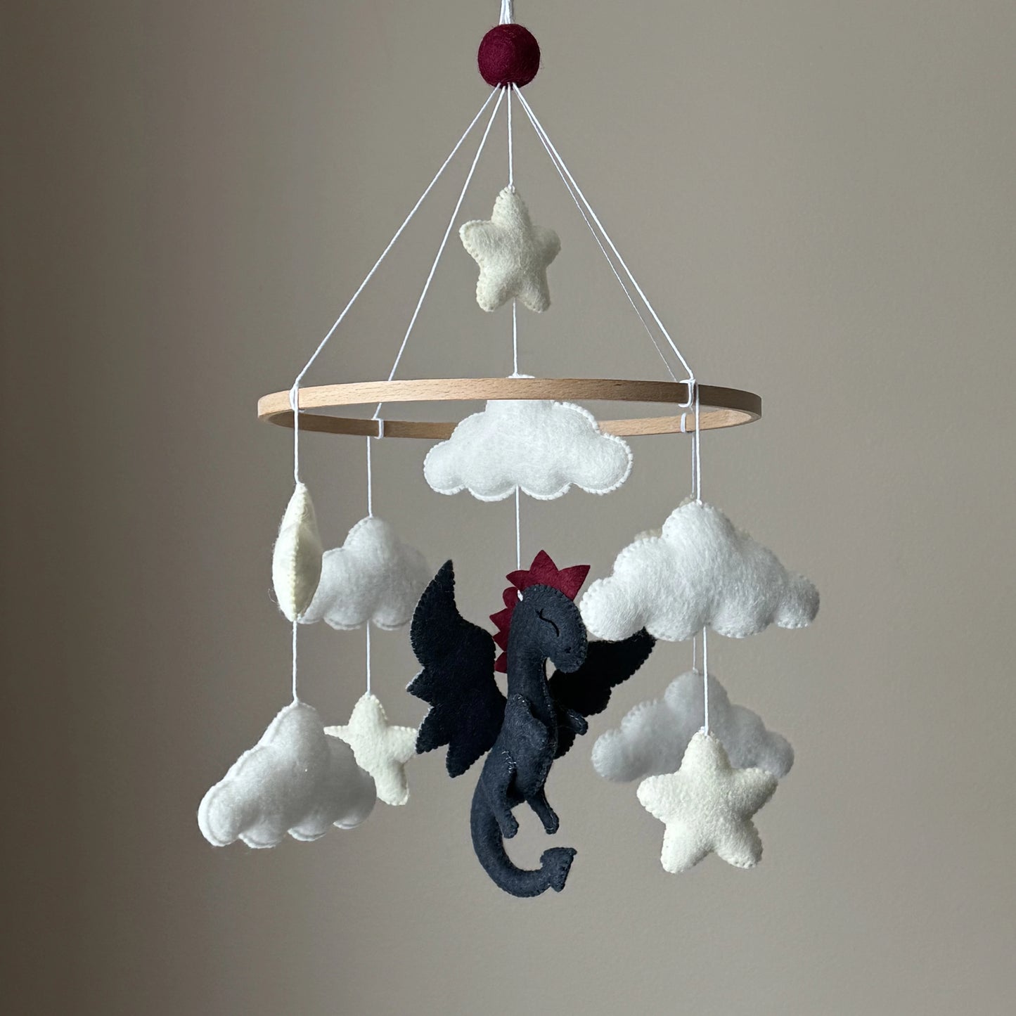 Handmade dragon baby mobile with felt clouds and stars for nursery 