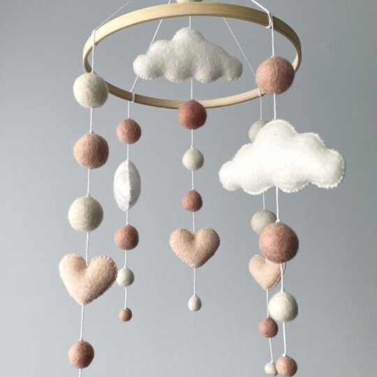 Cute mobile with hearts and clouds