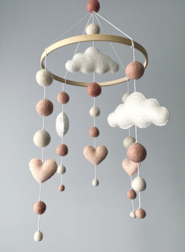 Cute mobile with hearts and clouds