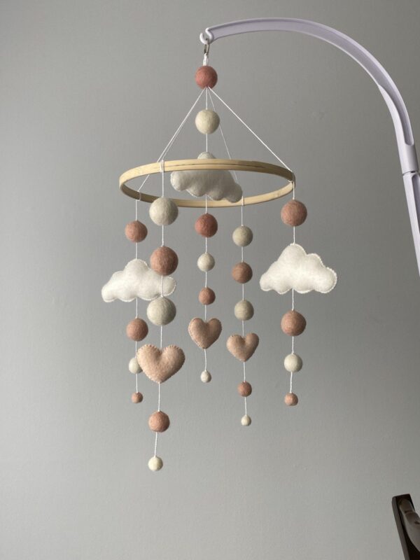 Cute mobile with hearts and clouds