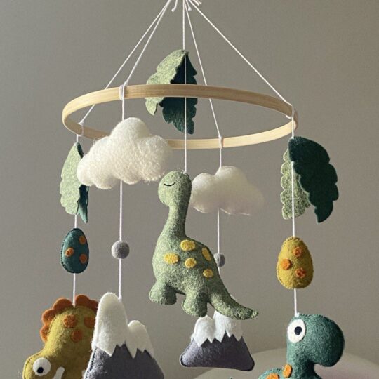 Baby mobile with three different dinosaurs