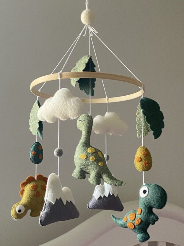 Baby mobile with three different dinosaurs