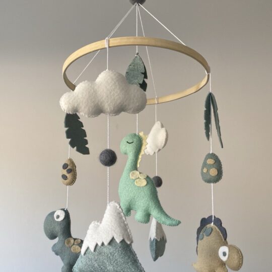 Dinosaur themed baby mobile featuring three different dinosaurs