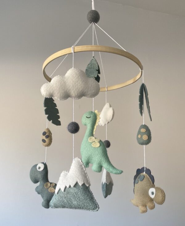 Dinosaur themed baby mobile featuring three different dinosaurs