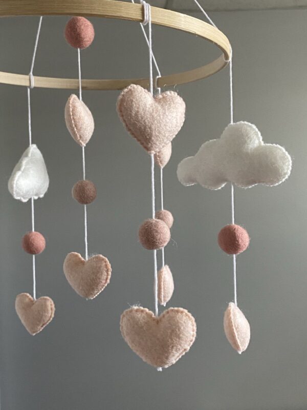 Clouds mobile with pink hearts