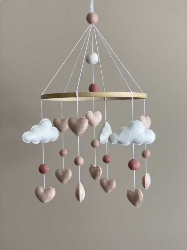 Clouds mobile with pink hearts