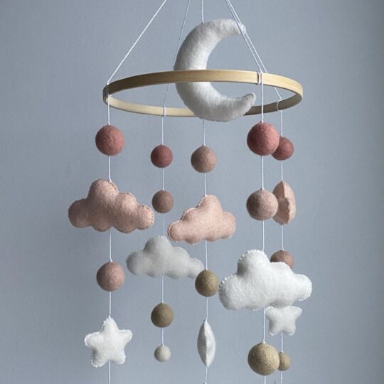 Baby mobile with moon and pink clouds