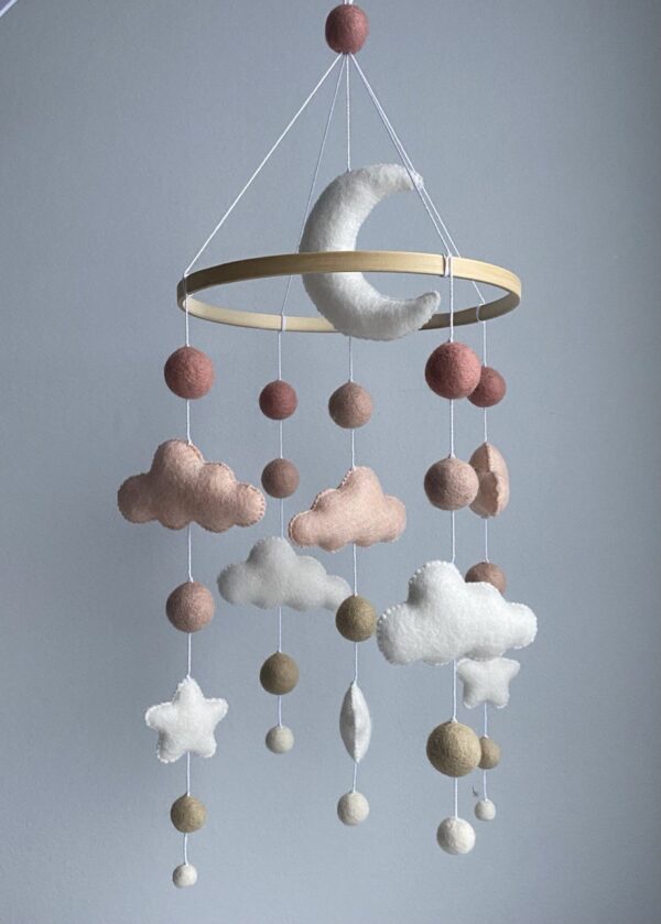 Baby mobile with moon and pink clouds