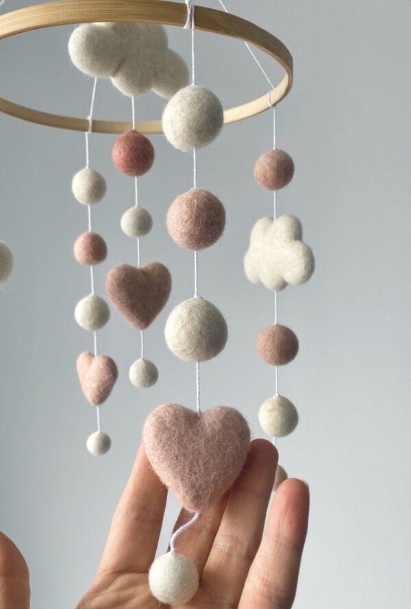 Cute felt balls mobile with hearts and clouds