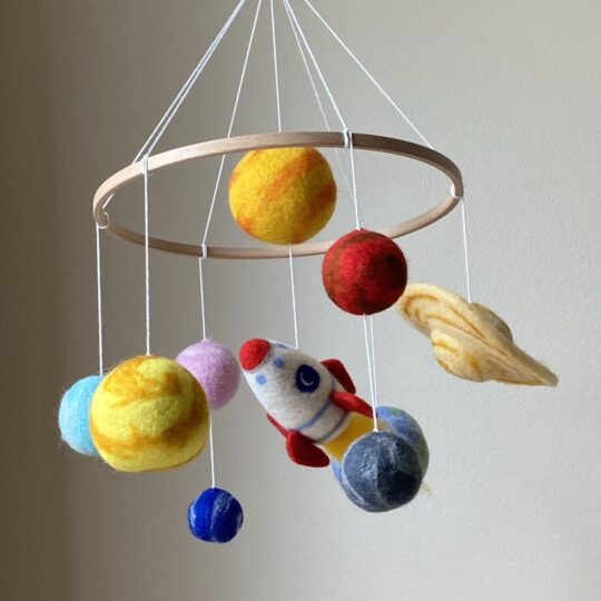 Solar system mobile with rocket