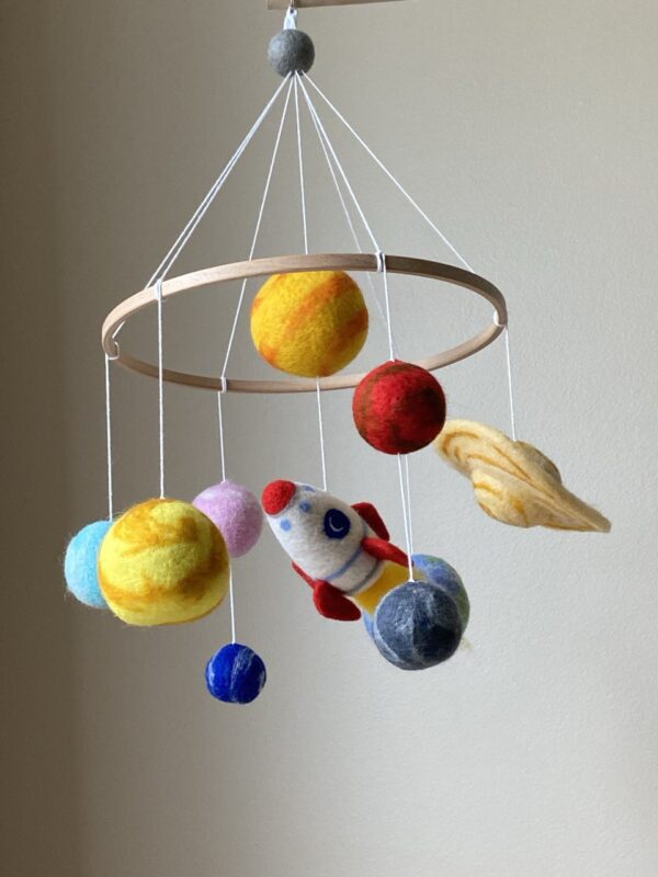 Solar system mobile with rocket