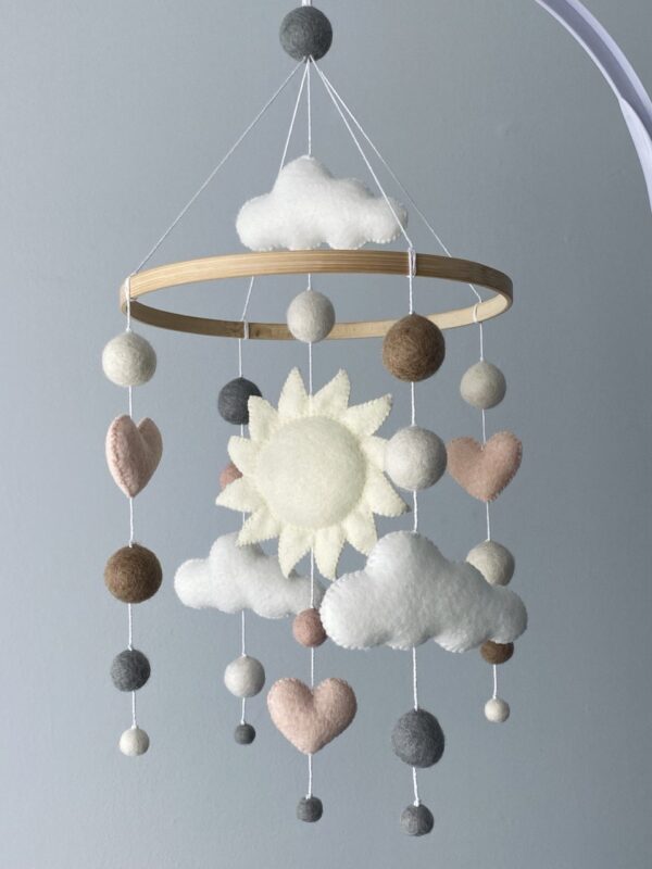 Baby mobile with hearts and clouds